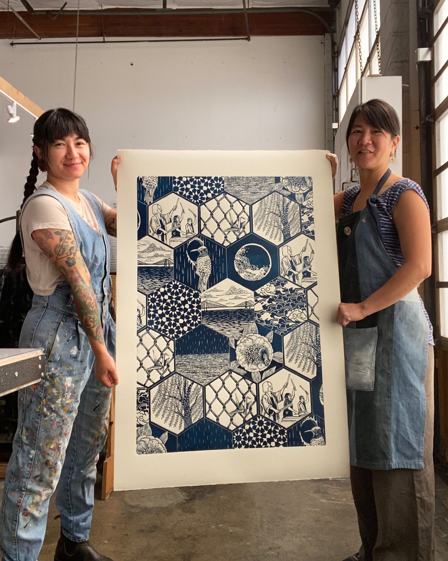 Yoshi and Saiyure holding their print Sound