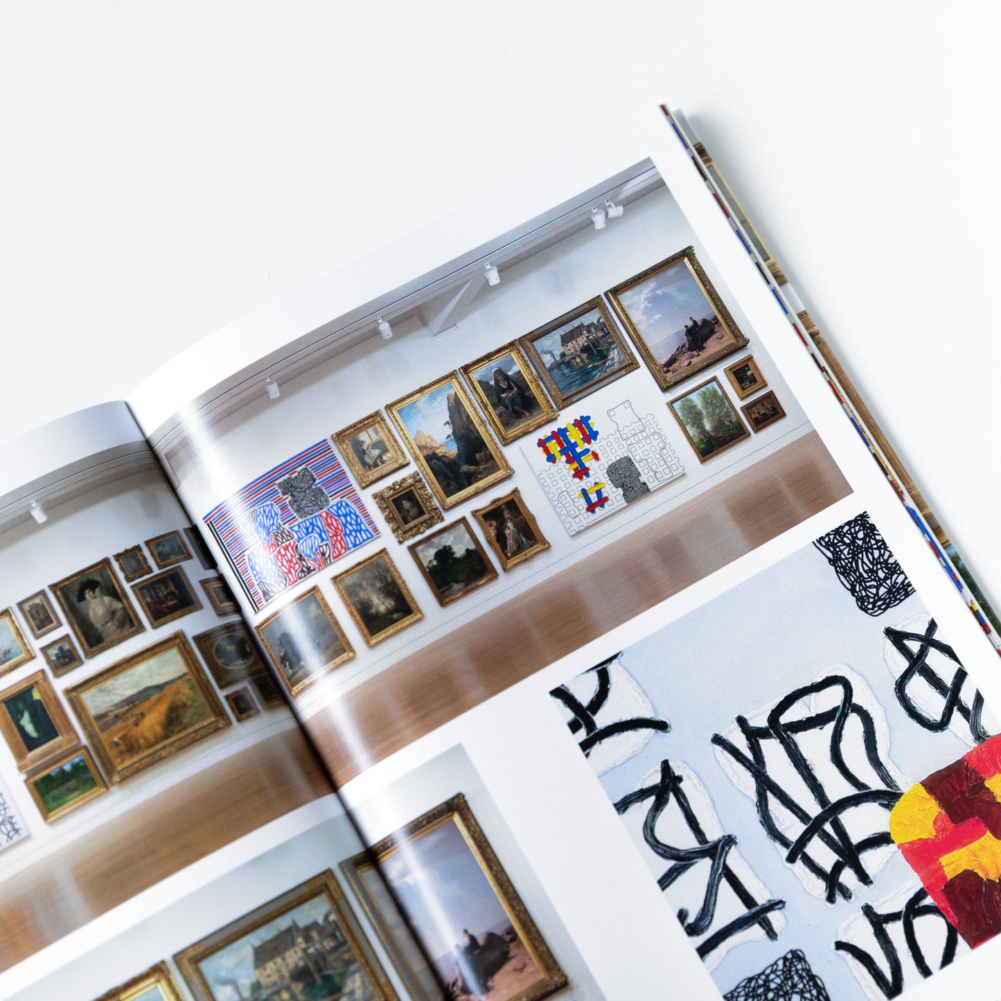 Open book displaying various art pieces and designs.