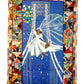 Colorful quilt with a central design of a woman in a white dress against a blue background, surrounded by a decorative border.
