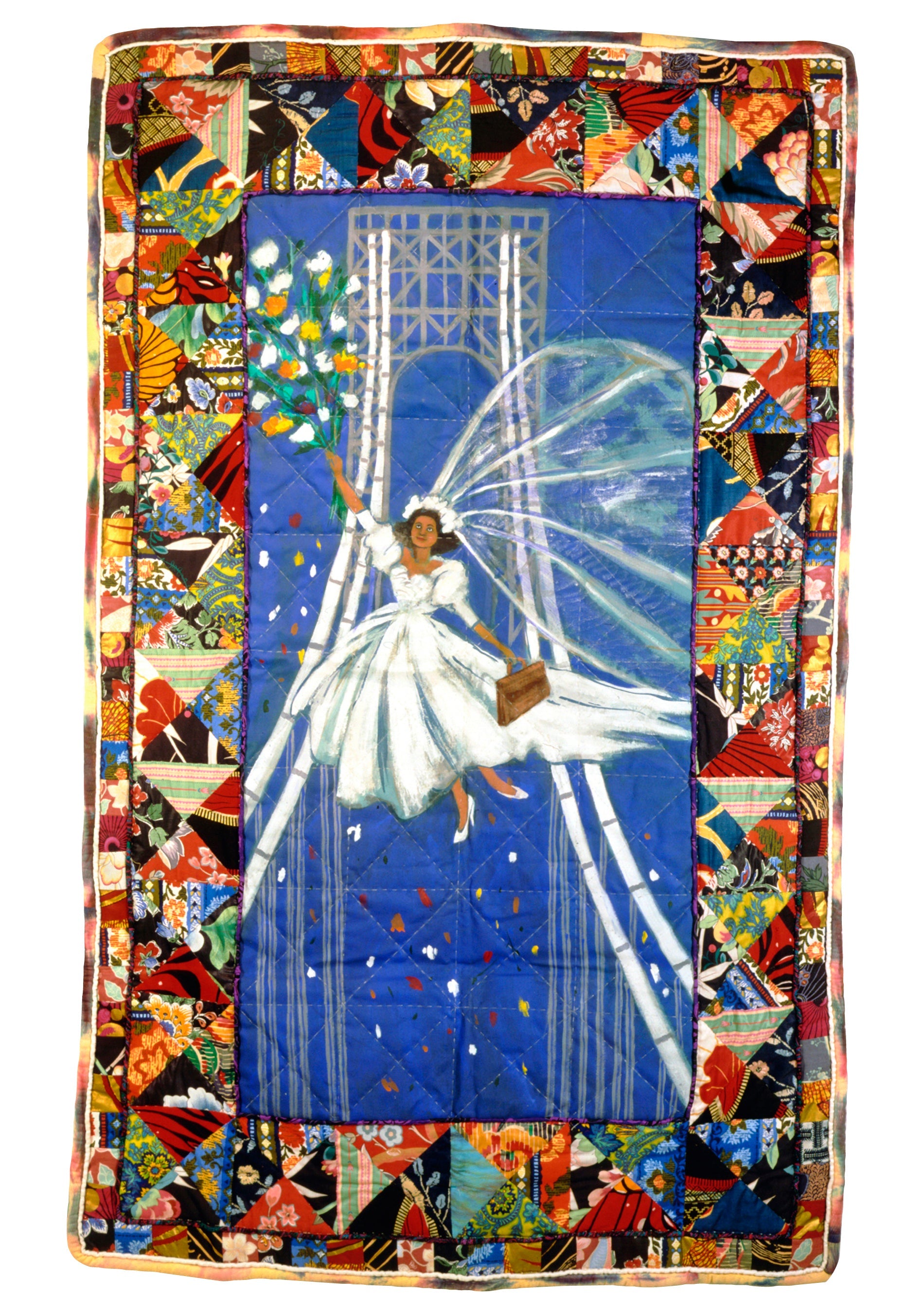 Colorful quilt with a central design of a woman in a white dress against a blue background, surrounded by a decorative border.
