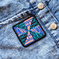 colorful "Love Black Life" patch on denim jacket. 