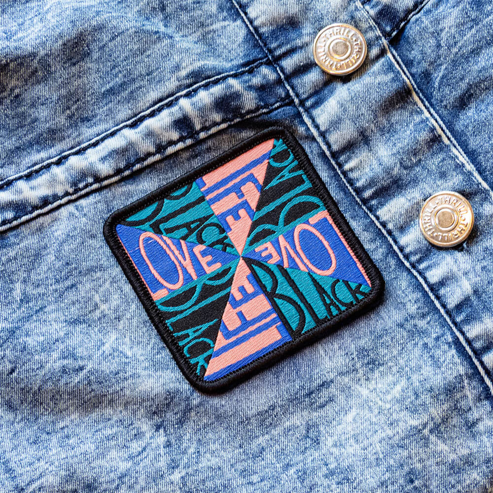 colorful "Love Black Life" patch on denim jacket. 